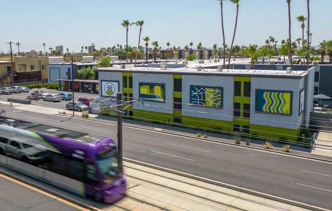 a bus on a street in front of a building