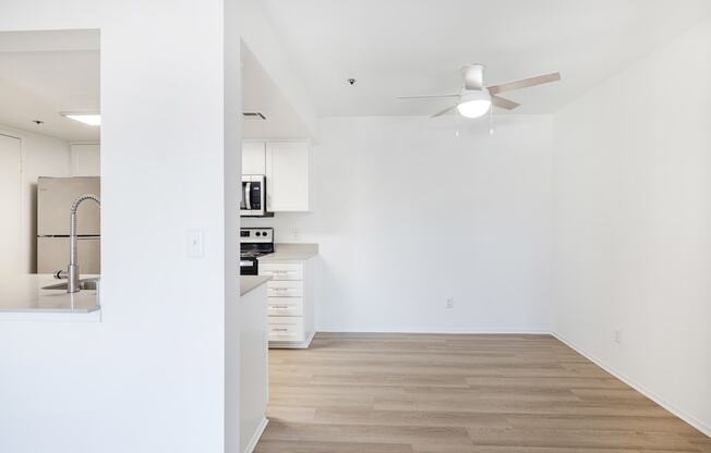 a bedroom with a medium sized bed and a ceiling fan