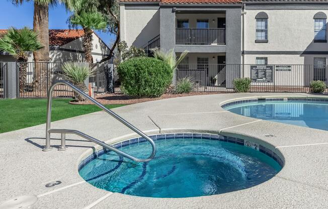 a house with a pool in front of a building