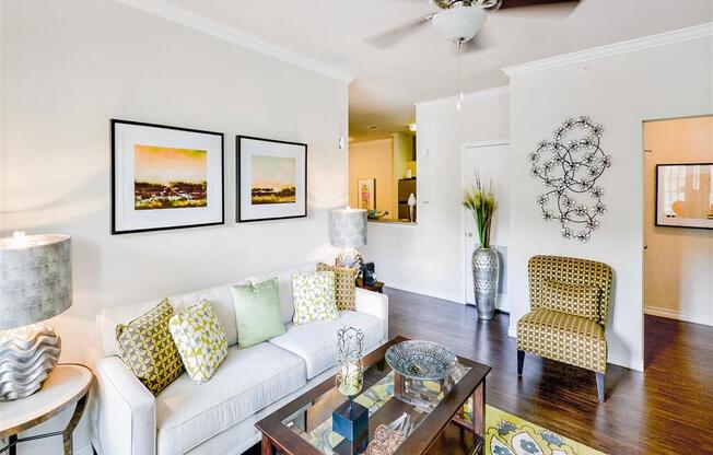 Spacious living rooms with ceiling fans at Mission at La Villita Apartments in Irving, TX offers 1, 2 & 3 bedroom apartment homes with appliances.