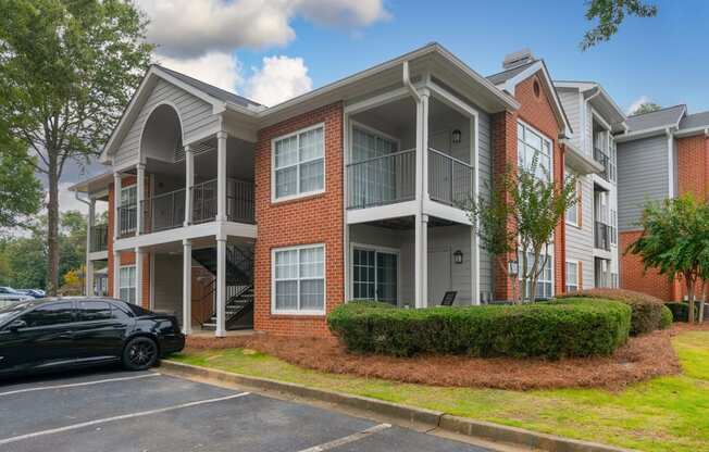 an apartment building with a car parked in front of it at Twenty35 at Timothy Woods, Athens