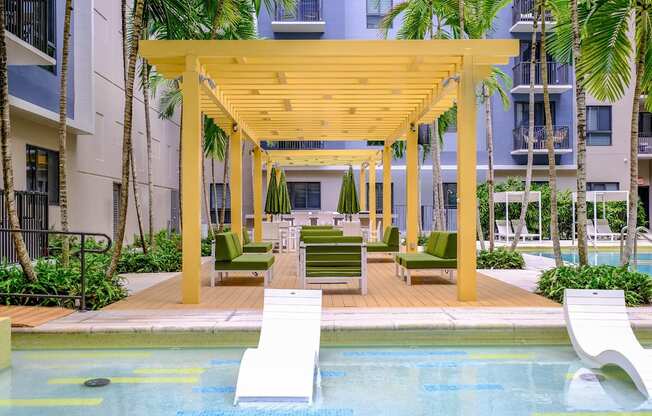 swimming pool with aqua sun ledge at Berkshire Coral Gables apartments