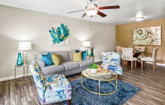 our apartments offer a living room with a couch a coffee table and a dining table