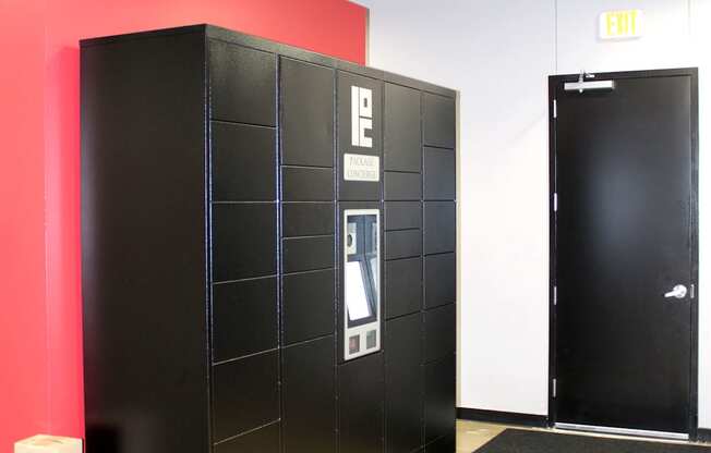 A black filing cabinet with a white label on it.