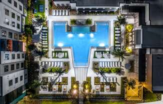 a birds eye view of a hotel with a pool in the middle of a building at The Alibi at Lake Lilly, Ocoee, FL