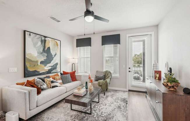 Furnished living room in two bedroom apartment model