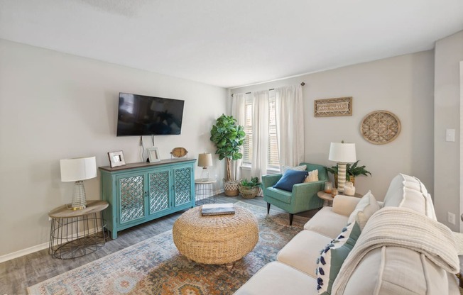 a living room with a couch and a tv