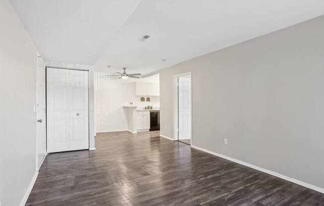 A room with a wooden floor and white walls.