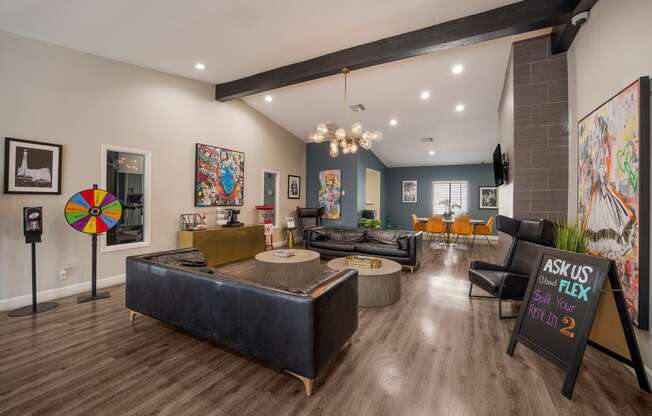 Clubhouse with couches and chairs and a table at 2900 Lux Apartment Homes, Nevada