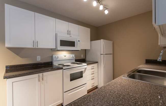 This is a photo of the kitchen in the 1170 square foot 2 bedroom, 2 bath Freedom Balcony at Washington Place Apartments in Miamisburg, Ohio in Washington Township.