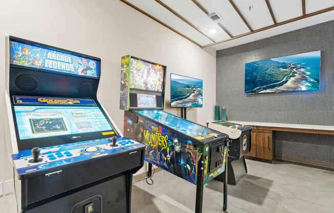 A room with two pinball machines, one of which is Monsters.