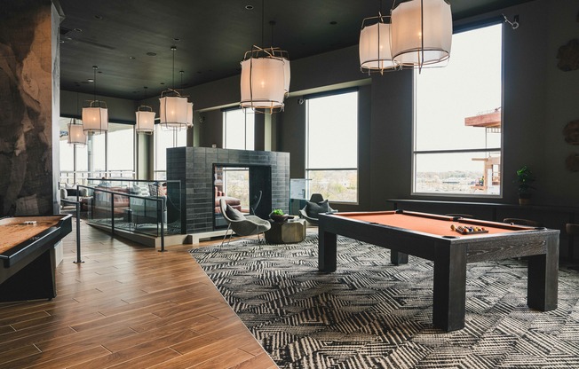 Spacious rooftop deck with expansive river views, featuring billiards and shuffleboard for your enjoyment.