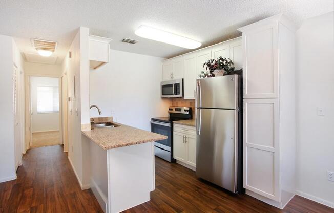 a kitchen with a wood floor