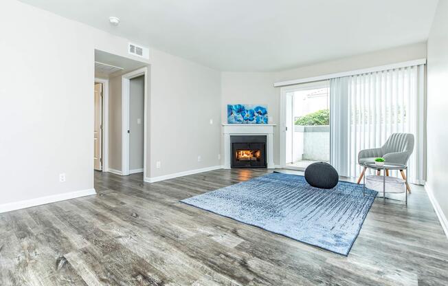 a living room filled with furniture and a large window