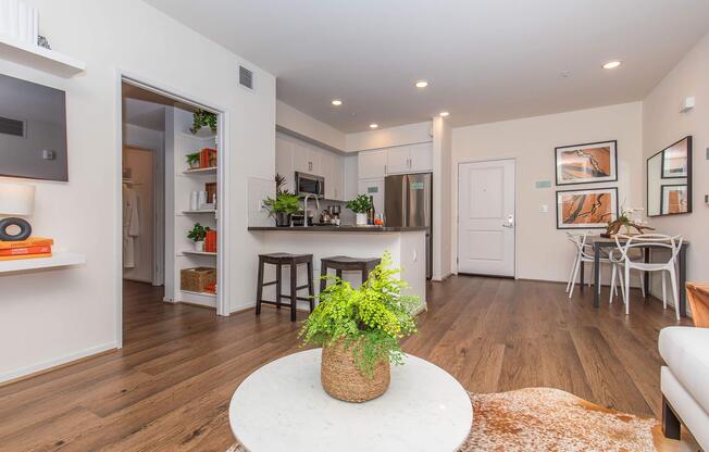 a living room filled with furniture and a refrigerator