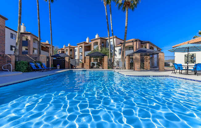 Mission Antigua Apartments in Tucson, Arizona Exterior and Pool with Lounge Chairs