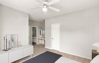 a bedroom with a bed and a ceiling fan at Veranda at Centerfield, Houston, 77070
