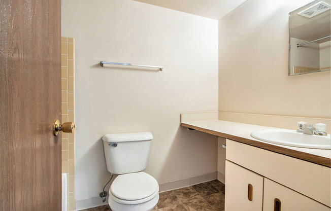 a bathroom with a toilet and a sink