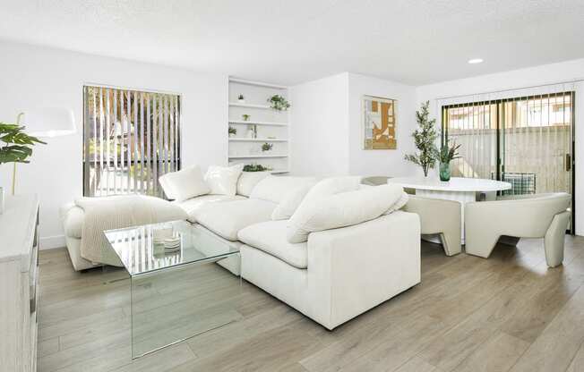 a living room with a white couch and a table