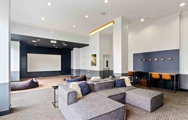 resident lounge with movie screen and seating