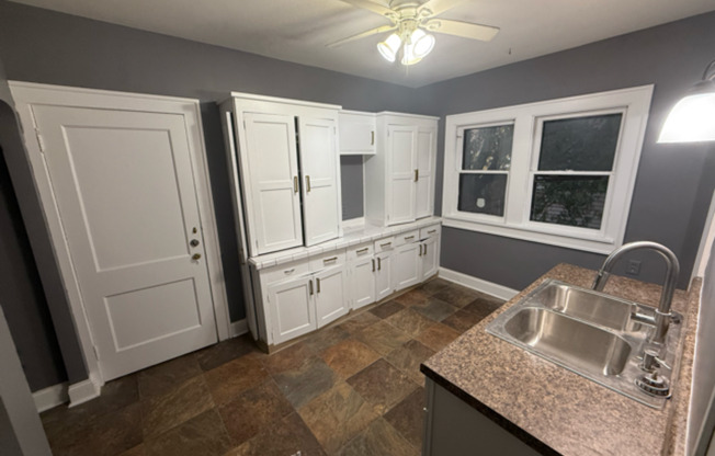 ✨ Updated 4BR/2BA Single-Family Home — Garage Parking, Water & Lawn Care Included ✨