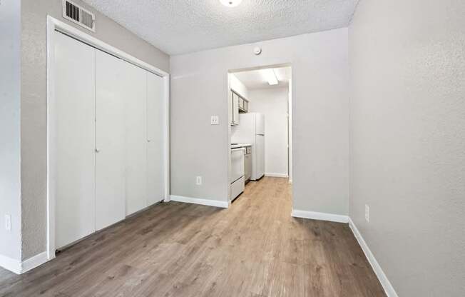 A room with a white door and a white cabinet.
