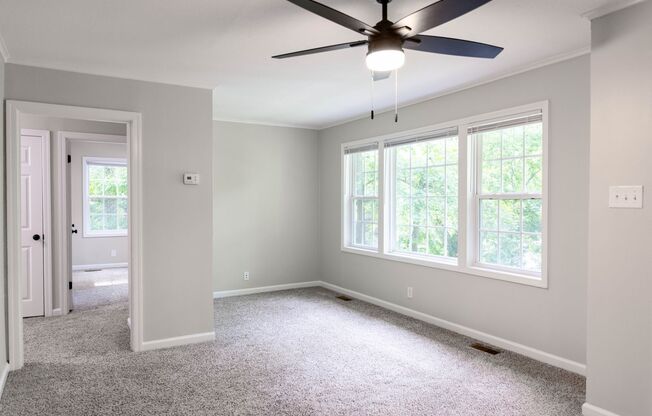 Charming Three Bedroom Home with Natural Privacy and Prime Location