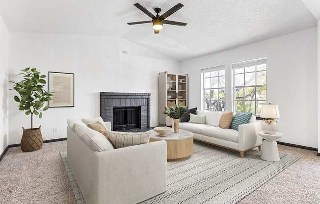 a living room with two couches and a fireplace