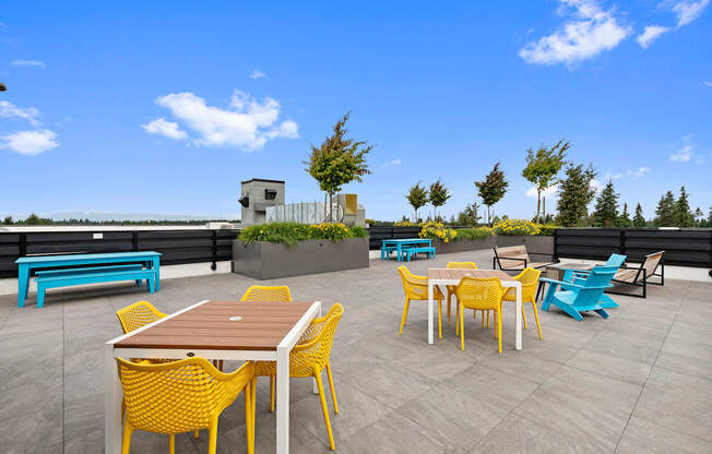 Resident rooftop terraces with tables and chairs at Arabella Apartment Homes, Shoreline, Washington 98155