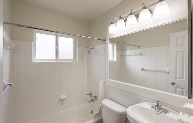 This is a photo of the bathroom of the 1004 square foot, 2 bedroom/1 bath Townhome with stackable washer/dryer floor plan at Colonial Ridge Apartments in the Pleasant Ridge neighborhood of Cincinnati, OH.