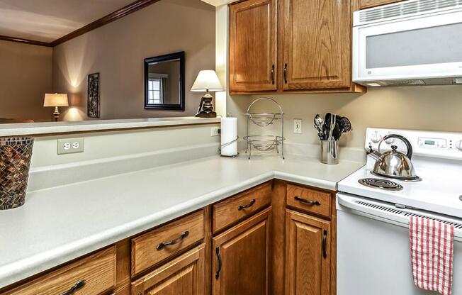 a kitchen with a stove top oven and a sink