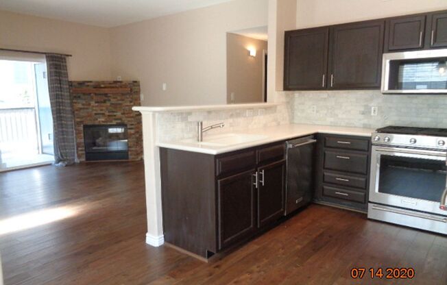 Stunning 2 BR/2 BA Lower Level Condo w/ 1 Car Detached Garage!!