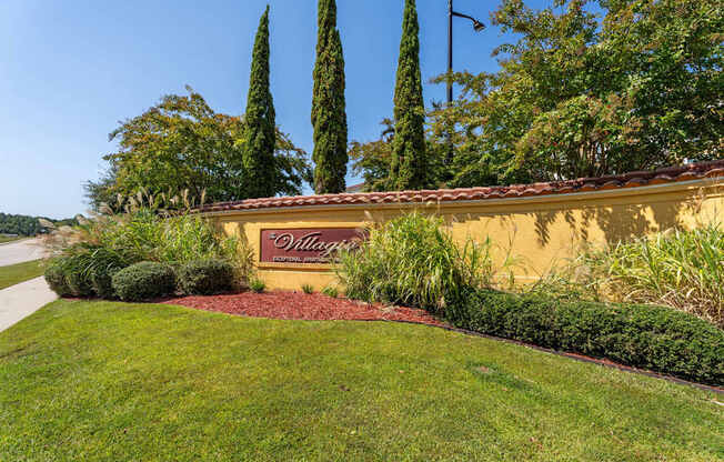 A villa with a garden in front of it.