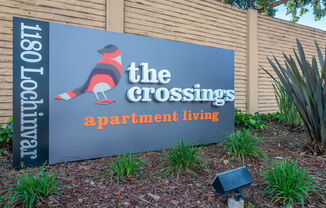 a sign for the crossroads apartments at the entrance to the building at Sunnyvale Crossings Apartments, LLC, Sunnyvale, CA