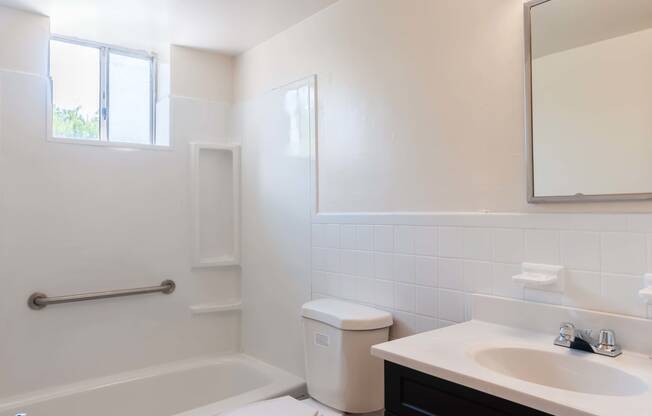 a bathroom with a toilet sink and bathtub