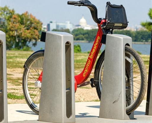 a bike is parked next to a pole