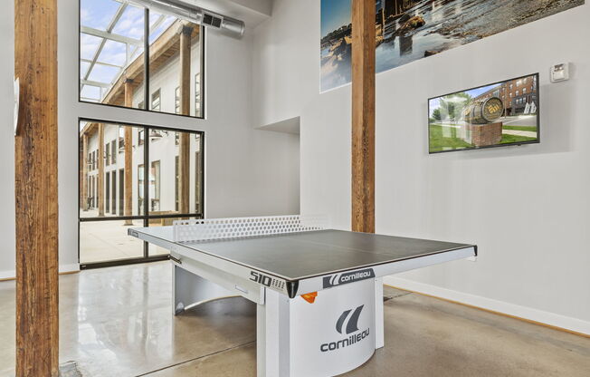 a ping pong table in a white room