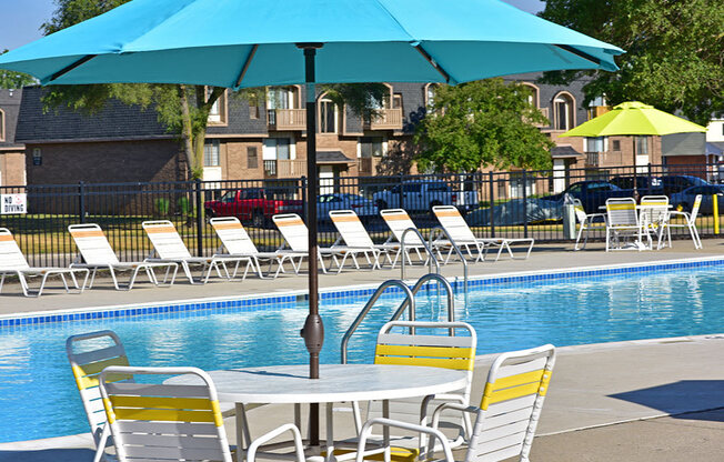 Poolside Seating with Umbrella at Windsor Place, Davison, MI, 48423