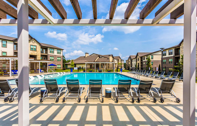 our apartments have a large swimming pool with chairs