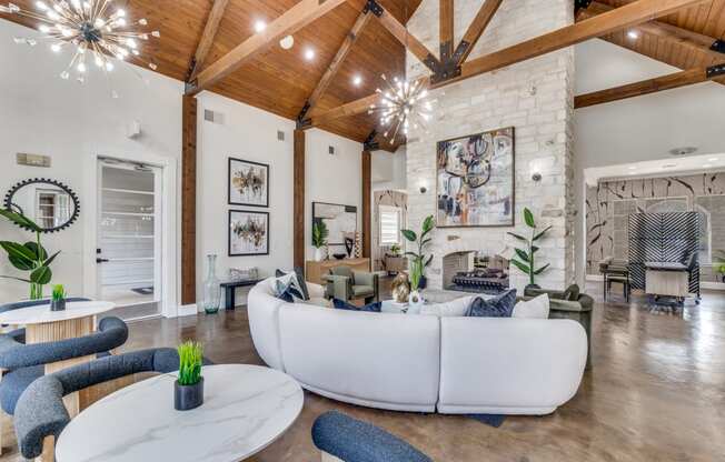 a living room with a white couch and a fireplace