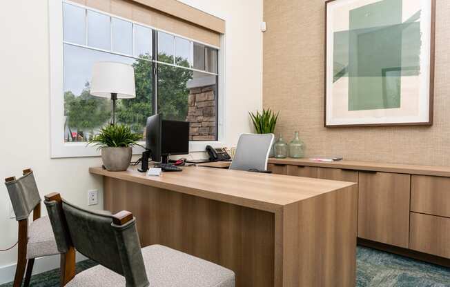 a office with a desk and a window