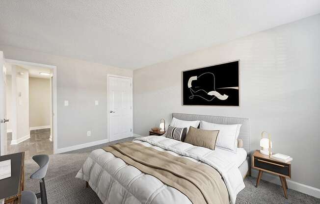 Model Bedroom with Carpet and Hallway View at Middlesex Crossing Apartments in Billerica, MA.