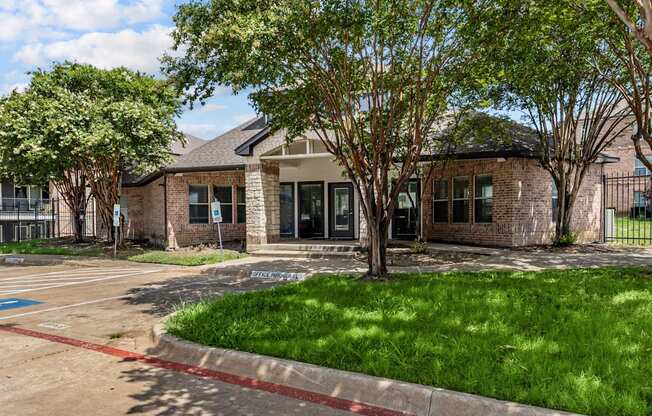 A building with a parking lot in front of it.