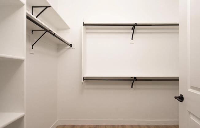 Oversized closet with built-in shelving and double hanging rods—designed to keep your wardrobe organized and within reach.