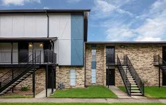 a view of a building with a stairway in front of it
