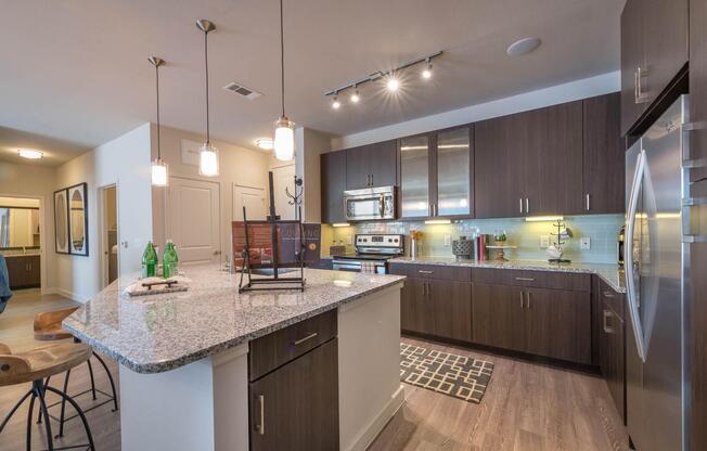 a modern kitchen with stainless steel appliances