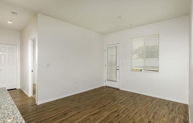 Patio door with a window on the side and spacious living room