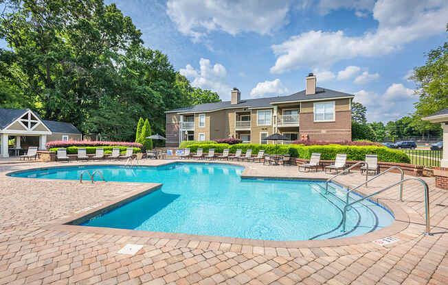 Outdoor Pool & Sundeck With Lush Landscaping