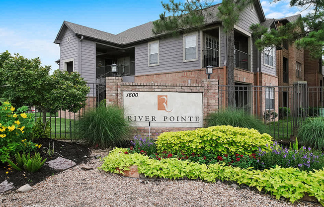 The front of a building with a sign that says River Pointe.