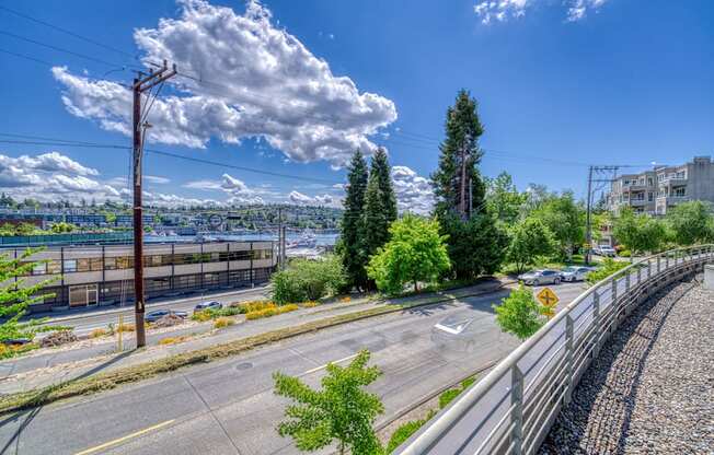 A street view with a clear sky and a few clouds.